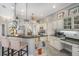 Stylish kitchen boasts granite countertops, a breakfast bar, white cabinetry, and modern stainless steel appliances at 6088 Sabal Hammock Cir, Port Orange, FL 32128