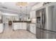 Open-concept kitchen features stainless steel appliances, ample storage, and easy access to the living and dining spaces at 6088 Sabal Hammock Cir, Port Orange, FL 32128
