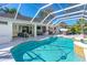 Backyard pool area featuring a screened-in pool, patio and outdoor furniture at 6088 Sabal Hammock Cir, Port Orange, FL 32128
