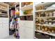 Organized walk-in closet featuring shelving, drawers, and hanging rods for ample storage of clothing and accessories at 6088 Sabal Hammock Cir, Port Orange, FL 32128