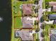 Aerial view of a home with a large lot, lake view, and landscaped yard at 637 Marisol Dr, New Smyrna Beach, FL 32168