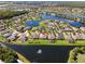 Scenic aerial view of a lakeside community with beautiful homes and lush landscaping at 637 Marisol Dr, New Smyrna Beach, FL 32168