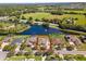 Aerial view of home showcasing the pond, yard, and surrounding landscape at 637 Marisol Dr, New Smyrna Beach, FL 32168