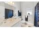 Bright bathroom with a single sink vanity, and a shower featuring an anchor-themed curtain at 637 Marisol Dr, New Smyrna Beach, FL 32168