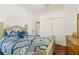 Bedroom featuring a queen bed with wood flooring and a large closet at 637 Marisol Dr, New Smyrna Beach, FL 32168