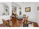Elegant dining room features a wooden table, decorative rug, and stylish overhead lighting fixture at 637 Marisol Dr, New Smyrna Beach, FL 32168