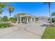 Beautiful single-story home with an attached two-car garage and a well manicured front yard at 637 Marisol Dr, New Smyrna Beach, FL 32168