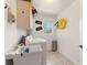 Functional laundry room featuring a utility sink and washer and dryer hookups at 637 Marisol Dr, New Smyrna Beach, FL 32168