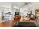 Spacious living room with hardwood floors, a ceiling fan, and an open layout to the kitchen at 637 Marisol Dr, New Smyrna Beach, FL 32168