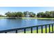 Picturesque pond features a tranquil fountain, bordered by mature trees and landscaping at 637 Marisol Dr, New Smyrna Beach, FL 32168