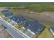 Aerial view showcases modern gray townhomes in a peaceful neighborhood at 6456 Roseberry Ct, Port Orange, FL 32128