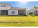 A well-maintained backyard features lush green grass and meticulous landscaping for serene outdoor enjoyment at 6456 Roseberry Ct, Port Orange, FL 32128