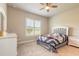 Cozy bedroom featuring a comfortable bed, neutral walls, and a large window with shutter blinds at 6456 Roseberry Ct, Port Orange, FL 32128