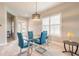 Dining area features stylish lighting and a glass table at 6456 Roseberry Ct, Port Orange, FL 32128