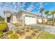 Striking exterior view highlights the two-car garage, complemented by meticulous landscaping and a paved driveway at 6456 Roseberry Ct, Port Orange, FL 32128