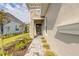 Inviting front door surrounded by colorful landscaping, adding charm and personality to the entrance at 6456 Roseberry Ct, Port Orange, FL 32128