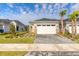 Charming single-Gathering home with a two-car garage, stone accents, and manicured landscaping at 6456 Roseberry Ct, Port Orange, FL 32128