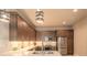 A spacious kitchen featuring stainless steel appliances, custom cabinetry, and a breakfast bar at 6456 Roseberry Ct, Port Orange, FL 32128