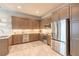 Well-equipped kitchen featuring stainless steel appliances, granite countertops, and custom cabinetry at 6456 Roseberry Ct, Port Orange, FL 32128