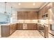 Spacious kitchen featuring stainless steel appliances, granite countertops, and custom cabinetry at 6456 Roseberry Ct, Port Orange, FL 32128
