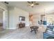 Open concept living room with tile flooring, large windows, and comfortable seating at 6456 Roseberry Ct, Port Orange, FL 32128