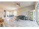 Open-concept living room with tile floors flows into the dining area at 6456 Roseberry Ct, Port Orange, FL 32128