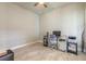 A home office offers tile flooring, a ceiling fan, and natural light, creating a productive workspace at 6456 Roseberry Ct, Port Orange, FL 32128