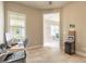 This office features an adjoining room, tiled floors, bright windows, and natural light at 6456 Roseberry Ct, Port Orange, FL 32128