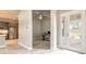 Bright office space featuring a front entry and views to the kitchen at 6456 Roseberry Ct, Port Orange, FL 32128
