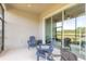 Relaxing screened-in patio with a ceiling fan and access to the living room at 6456 Roseberry Ct, Port Orange, FL 32128