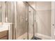 Elegant shower with stylish tile, a seamless glass door, and modern fixtures for a luxurious feel at 6456 Roseberry Ct, Port Orange, FL 32128