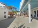 Expansive back porch with access to the yard and upper deck, offering ample space at 6530 S Atlantic Ave, New Smyrna Beach, FL 32169