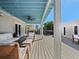 Beautiful covered porch with comfortable seating, perfect for outdoor relaxation at 6530 S Atlantic Ave, New Smyrna Beach, FL 32169
