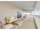 Inviting outdoor balcony with cozy seating and partial ocean views at 6530 S Atlantic Ave, New Smyrna Beach, FL 32169