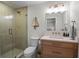 Contemporary bathroom featuring a glass shower, vanity, and elegant fixtures at 6530 S Atlantic Ave, New Smyrna Beach, FL 32169