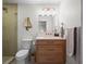 Modern bathroom featuring a glass-enclosed shower and stylish wood vanity at 6530 S Atlantic Ave, New Smyrna Beach, FL 32169