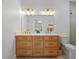 Elegant bathroom with double vanity, decorative mirrors, and soft lighting at 6530 S Atlantic Ave, New Smyrna Beach, FL 32169