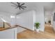 Spacious hallway with hardwood flooring and ample storage with built-in cabinets at 6530 S Atlantic Ave, New Smyrna Beach, FL 32169
