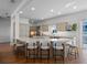 A spacious kitchen features an expansive island with seating and modern stainless steel appliances at 6530 S Atlantic Ave, New Smyrna Beach, FL 32169