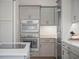 Modern kitchen appliances are featured in this view of the bright open-concept cooking space at 6530 S Atlantic Ave, New Smyrna Beach, FL 32169