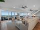 Spacious living room with ocean views, sectional sofa, and stylish decor at 6530 S Atlantic Ave, New Smyrna Beach, FL 32169
