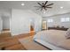 Bright main bedroom featuring hardwood floors, recessed lighting, and ensuite bathroom access at 6530 S Atlantic Ave, New Smyrna Beach, FL 32169