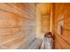 Inviting wooden sauna with bench seating and a heater for relaxation and wellness at 6530 S Atlantic Ave, New Smyrna Beach, FL 32169