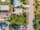 Aerial shot showcasing neighborhood homes, green space, inground pool, and road at 6860 Turtlemound Rd, New Smyrna Beach, FL 32169