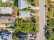 Aerial view of the property, showcasing its location near the ocean and river with a sunny backyard in a quaint community at 6860 Turtlemound Rd, New Smyrna Beach, FL 32169