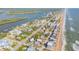 Comprehensive aerial view of the house, ideally situated near the ocean and river in a lively neighborhood at 6860 Turtlemound Rd, New Smyrna Beach, FL 32169