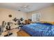 Bedroom featuring a weightlifting bench, desk, and a window with natural light at 6860 Turtlemound Rd, New Smyrna Beach, FL 32169