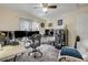 Office space featuring multiple monitors, a ceiling fan, and an interesting filing cabinet at 6860 Turtlemound Rd, New Smyrna Beach, FL 32169