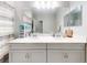 Bathroom boasts dual sinks and quartz countertops for a luxurious feel at 727 Porter Rye Ave, Debary, FL 32713