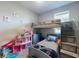 bedroom with bunkbeds, built-in steps, and dollhouse at 727 Porter Rye Ave, Debary, FL 32713